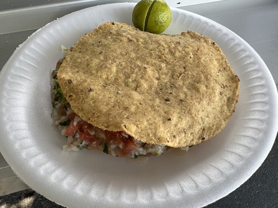 Seafood menu with tacos and ceviche.